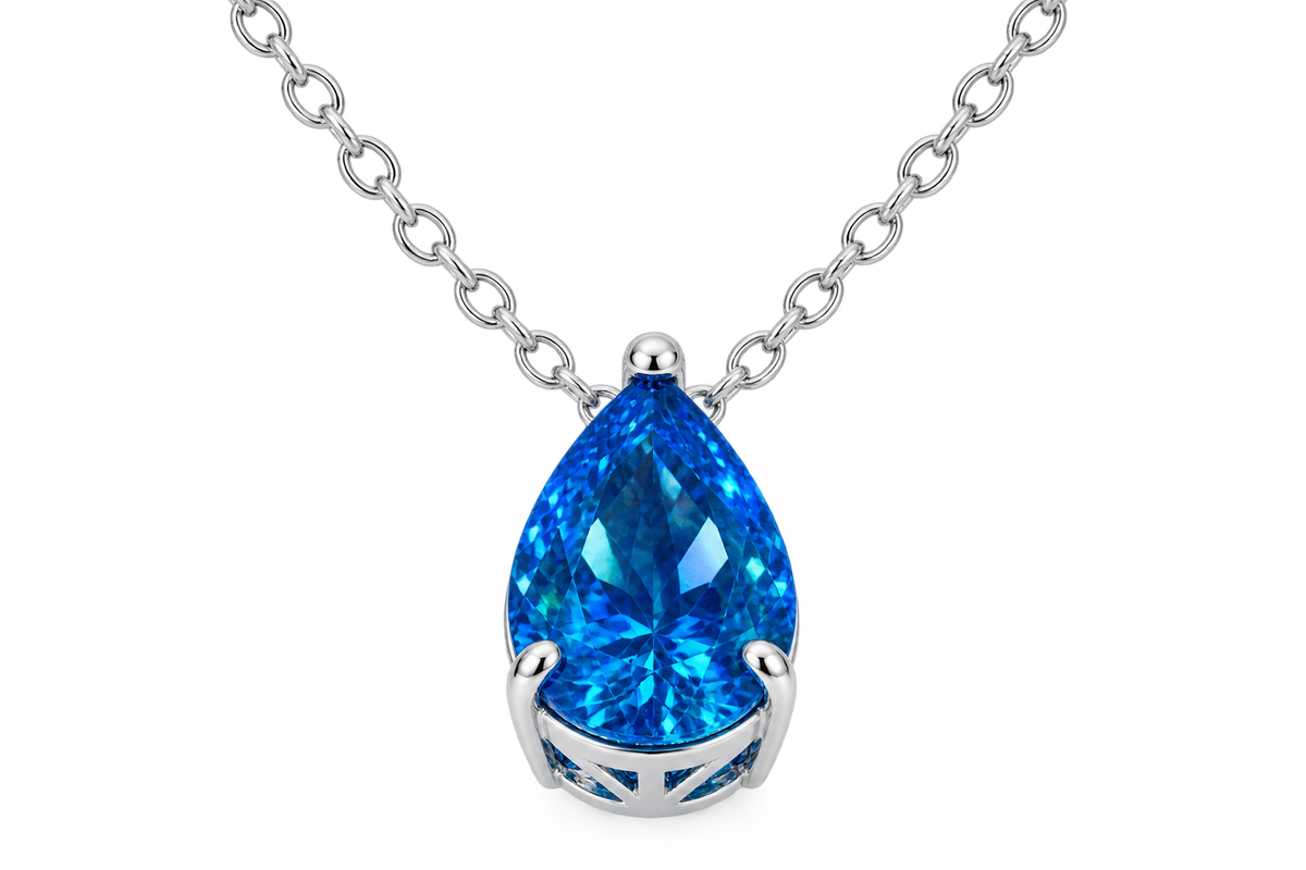Silver-tone necklace with vivid blue pear-cut cubic zirconia pendant on black