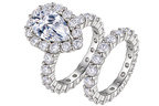The Pear Halo Set: 7 × 11 mm pear moissanite in a halo with a matching pavé eternity band — sterling silver two-ring set