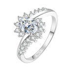 The Sunburst sterling silver moissanite ring on white — oval centre stone, radiating stones, crossover band stamped S925