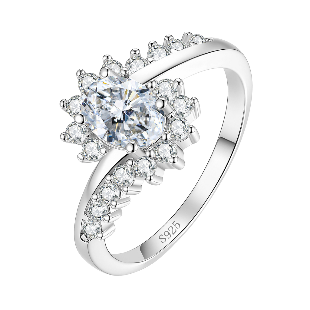 The Sunburst sterling silver moissanite ring on white — oval centre stone, radiating stones, crossover band stamped S925