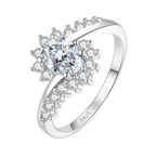The Sunburst sterling silver moissanite ring on white — oval centre stone, radiating stones, crossover band stamped S925
