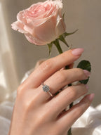 Silver-tone cubic zirconia solitaire ring worn on hand