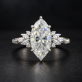 The Marquise sterling silver moissanite ring standing on a dark surface, 7 × 14 mm centre stone