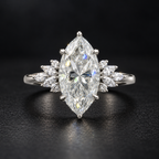 The Marquise sterling silver moissanite ring standing on a dark surface, 7 × 14 mm centre stone