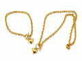 Gold-tone heart necklace and bracelet set on white background