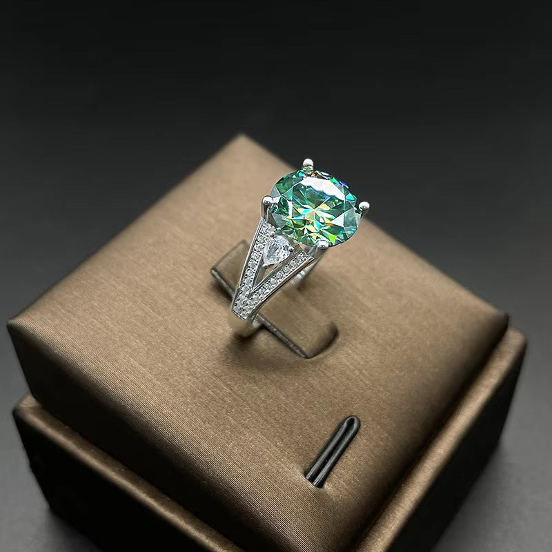 5 ct green moissanite statement ring on jewelry display