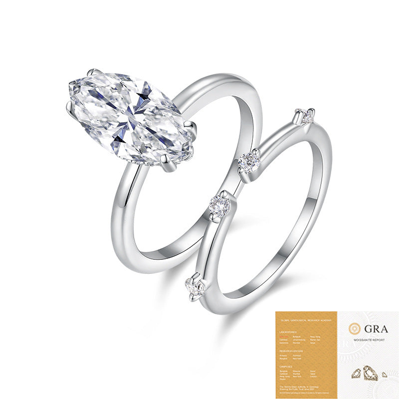 The Marquise Station Set: 7 × 14 mm marquise moissanite solitaire with a thin station band — sterling silver two-ring set