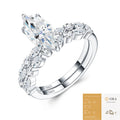 The Marquise Leaf Set: 6 × 12 mm marquise moissanite on a leaf-set shank with a matching leaf band — sterling silver two-ring set