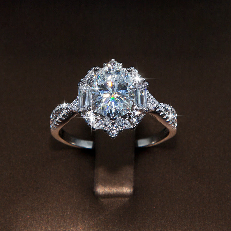 2 ct oval moissanite ring with round and baguette-cut accents