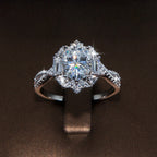 2 ct oval moissanite ring with round and baguette-cut accents