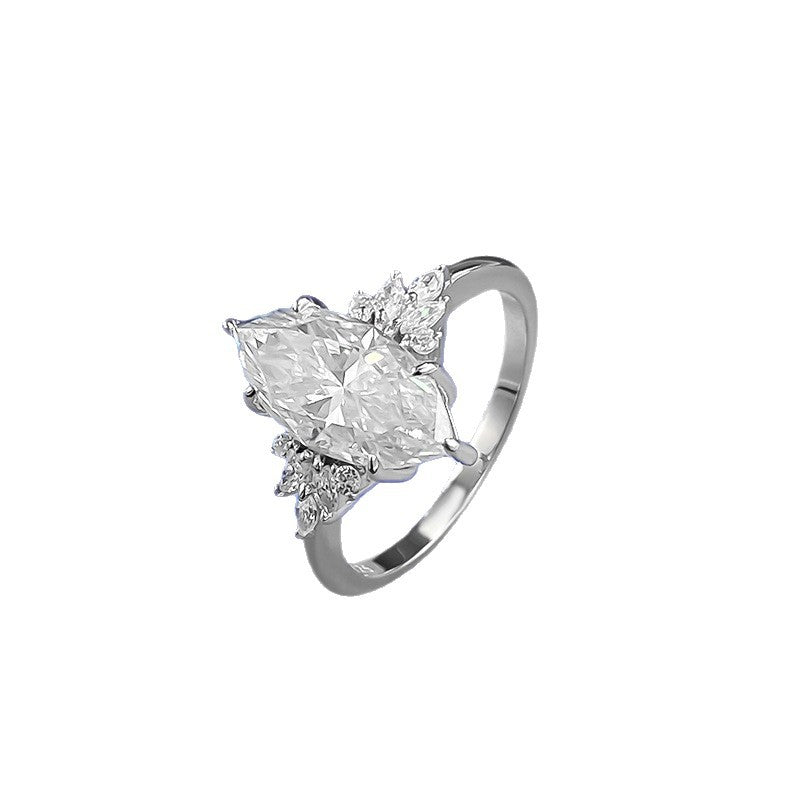 Marquise moissanite ring in sterling silver, angled side view showing the six-prong setting