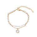 Layered gold-tone bracelet with faux pearls and round iridescent charm